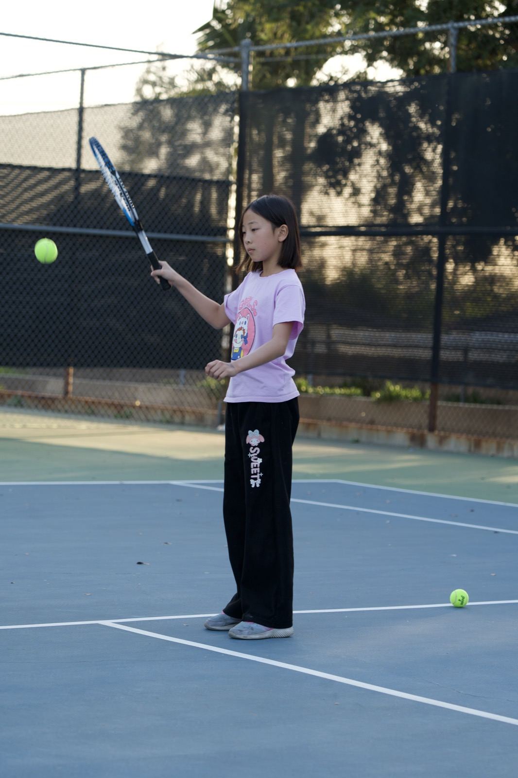 Young player practicing a serve