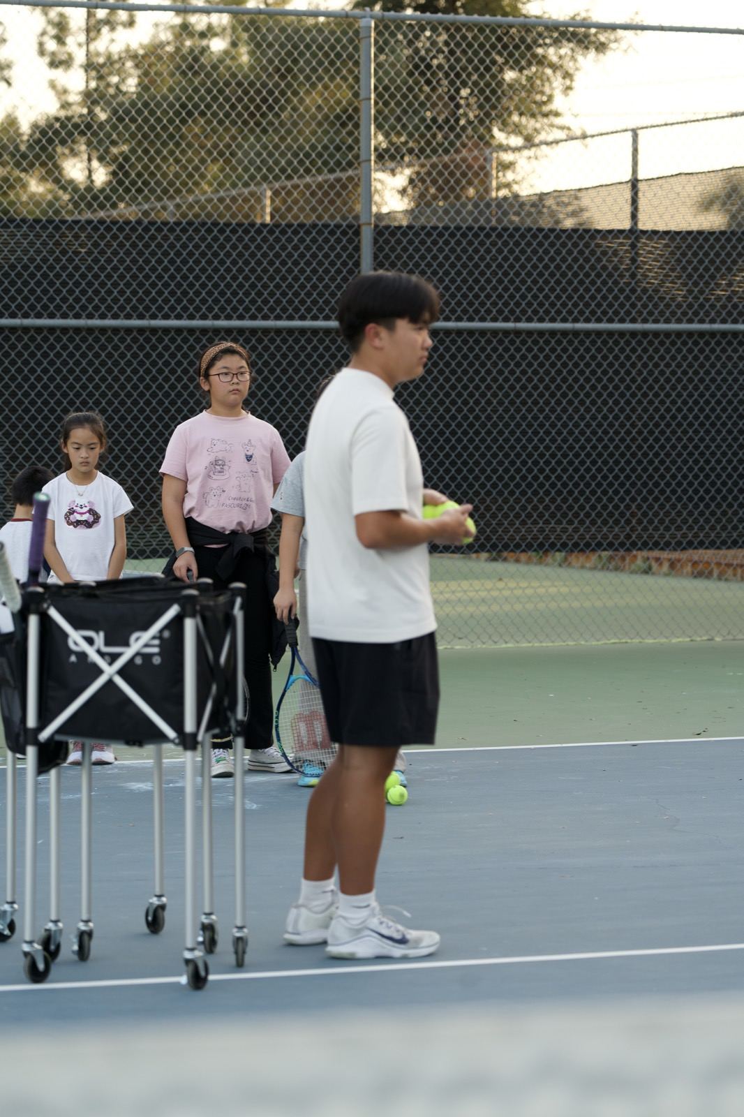 Coach running a drill with kids